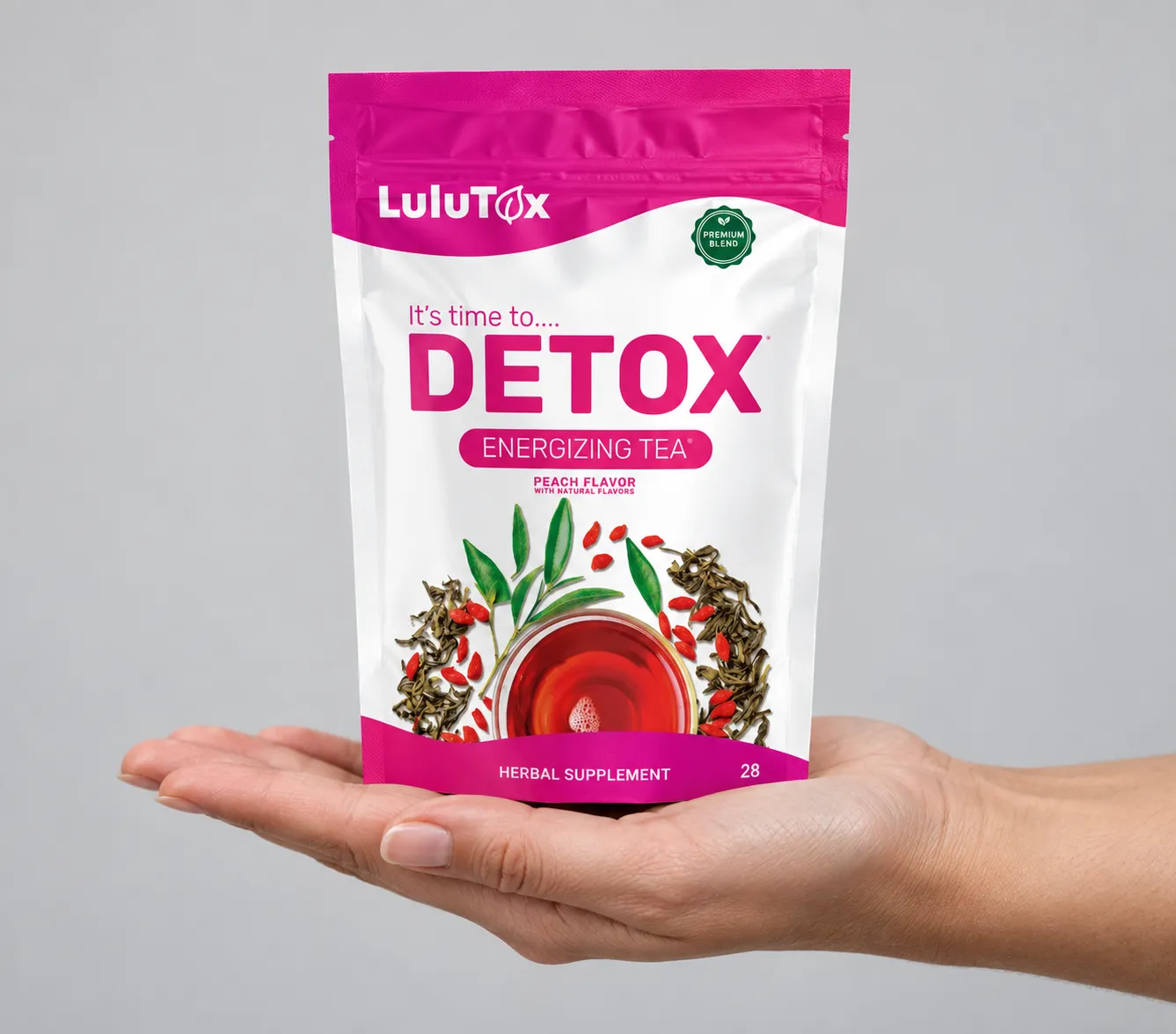 Lulutox Detox Tea HCTC — the package held in a hand